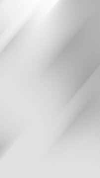 Soft diagonal lines create abstract grayscale gradient background with subtle texture, suitable for modern designs, presentations, digital art, and website backgrounds.