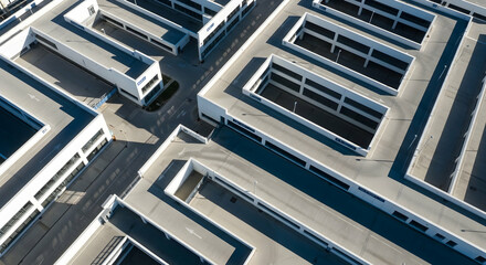 Aerial View Of Modern Industrial Architecture With Angular Shapes And Geometric Patterns
