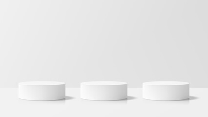 Three white cylindrical product podiums. Clean minimal exhibit mockup for product display. Studio geometric stage background.