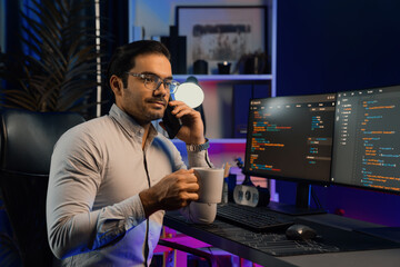 Smart IT developer calling to coworker with holding coffee cup solving error software development...