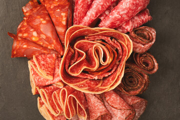 Different kinds of meat cuts on a board.