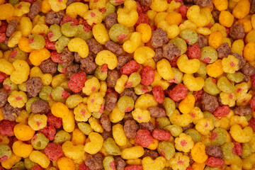 Sweet crunchy cornflakes as a background. Top view.