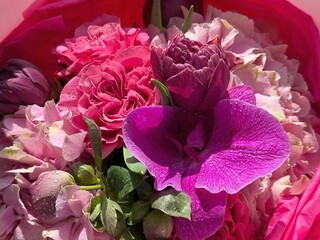 Bouquet of flowers roses, orchid, tulips.