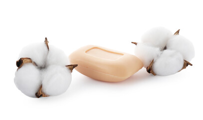 Soap bar and cotton flowers isolated on white