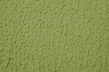 Close up of textured khaki color painted wall with rough stucco, plaster wall texture. Vibrant background, wallpaper, backdrop, design element.