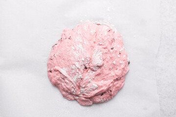 Overhead view of strawberry sourdough, top view of pink bread dough
