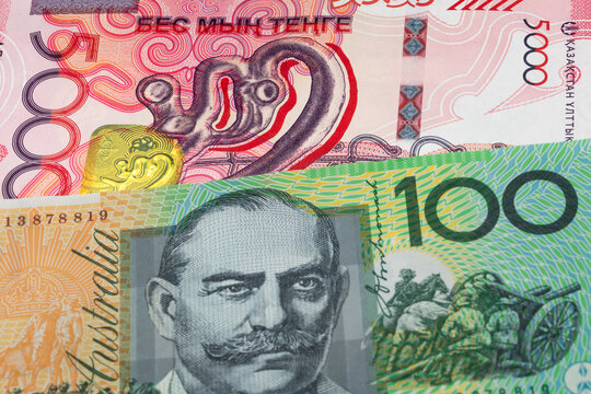 5000 Kazakhstani tenge and 100 Australian dollar banknotes. International trade concept