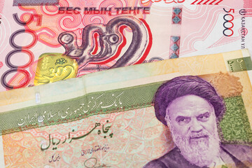 5000 Kazakhstani tenge and 50000 Iranian rial banknotes. International trade concept