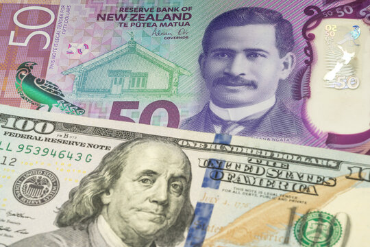 50 New Zealand dollar and 100 US dollar banknotes. International trade concept