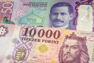 50 New Zealand dollar and 10000 Hungarian forint banknotes. International trade concept