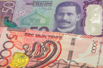 Fototapeta premium 50 New Zealand dollar and 5000 Kazakhstani tenge banknotes. International trade concept