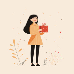 Cheerful girl holding a gift in autumn leaves