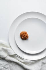 Overhead view of Akara on a white plate, top view of nigerian akara fried beans cake on a plate