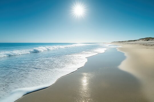 Ocean waves gently approaching sandy beach on a sunny day in outer banks, north carolina
