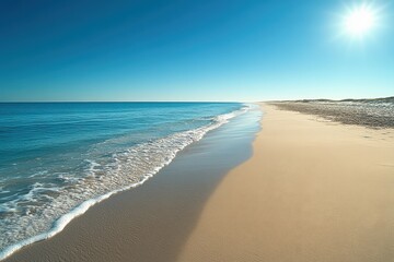 Obraz premium Ocean waves gently approaching sandy beach on a sunny day in outer banks, north carolina