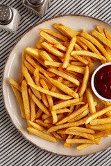 Homemade Golden French Fries with Ketchup, top view.