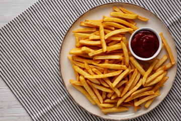 Homemade Golden French Fries with Ketchup, top view. Copy space.
