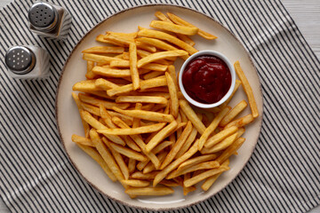 Homemade Golden French Fries with Ketchup, top view.