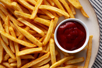 Homemade Golden French Fries with Ketchup, top view. Close-up.