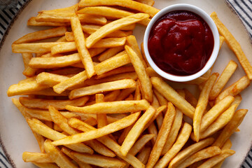 Homemade Golden French Fries with Ketchup, top view. Close-up.