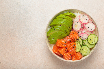 Poke bowl, a traditional hawaiian dish with diced raw salmon, avocado, vegetables served with rice and vegetables, a healthy meal on light background, copy space