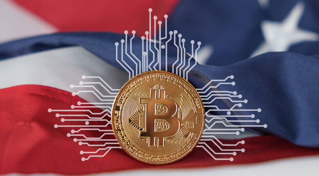 A coin with the letter B on it is on top of a red, white, and blue flag