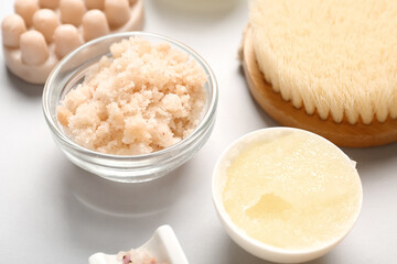 Scrubs with brush and soap on white background. Body massage concept