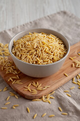 Organic Dried Orzo Pasta in a Bowl, side view.