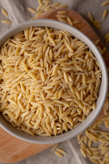 Organic Dried Orzo Pasta in a Bowl, top view.