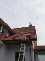 The structure on the house's tiled roof for installing solar panels, with microinverters also...