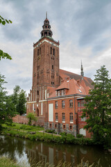 Imposing Lidzbark Warminski Church Tower Reflected in Water, Poland