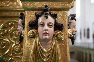 Close-Up of Ornate Golden Carved Head on Wooden Altar in Lidzbark Warminski, Poland