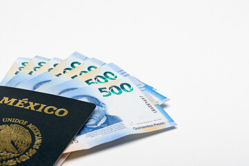 Mexican Passport and Five Hundred Peso Bills on white Background