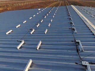 Structure on the house roof for solar panels with installed power optimizers
