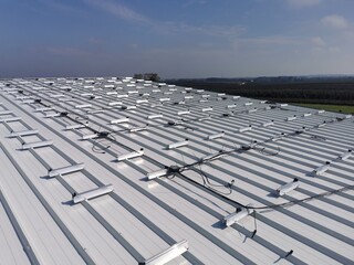 Structure on the house roof for solar panels with installed power optimizers