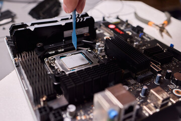 Carefully applying thermal paste on the CPU is essential for achieving optimal cooling performance