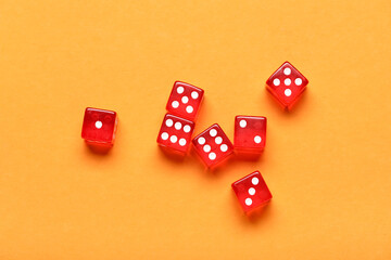 Red game dices on orange background