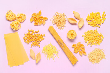 Composition with different types of raw tasty pasta on pink background
