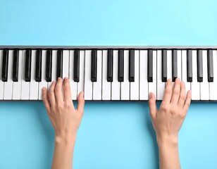 Hands playing a keyboard on a blue background