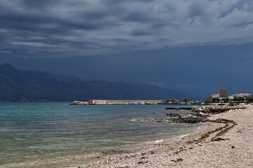 View of northern coastline of Razanac town with stony beaches, historical buildings in background....