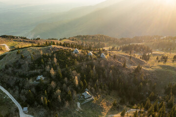 Mountain village in Alps, wooden houses at sunset, Velika Planina, Kamnik, Slovenia