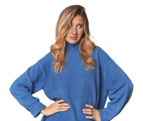 Caucasian blonde woman in studio confused, feels doubtful and unsure.