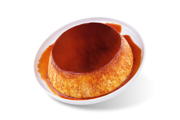 Caramel custard flan in the plate on a white isolated background