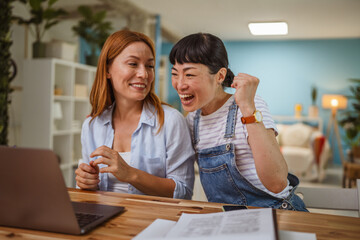 multicultural female friends discussing and working or teaching at home