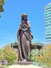 Statue in a public area in Mexico, it represents the summer, as one of four statues that represents...