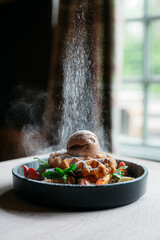 A dessert with a sprinkling of powdered sugar on top