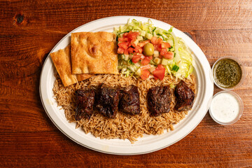 Grilled beef with rice and salad