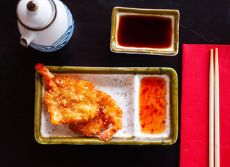 Appetizing fried shrimp with sauce. Close-up image