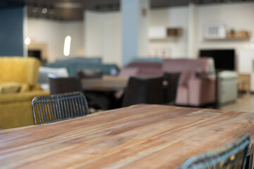 Wooden table displayed in department of furniture store close-up