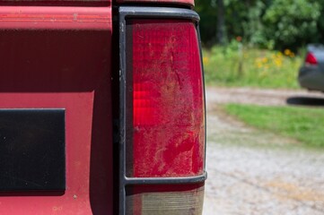 Close up of dirty red tail light